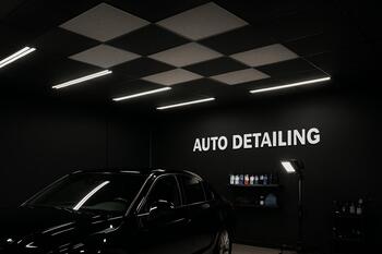 Acoustic ceiling panels above detailing bay