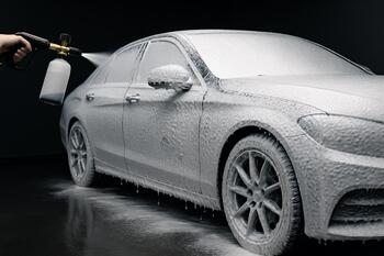 Touchless foam prewash lance blanketing panels