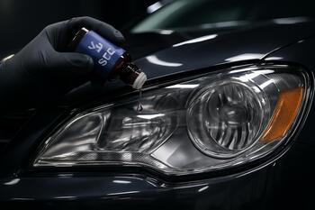 UV-stable seal coat being applied to headlight