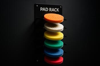 Color-coded pad rack for quick stepdown changes